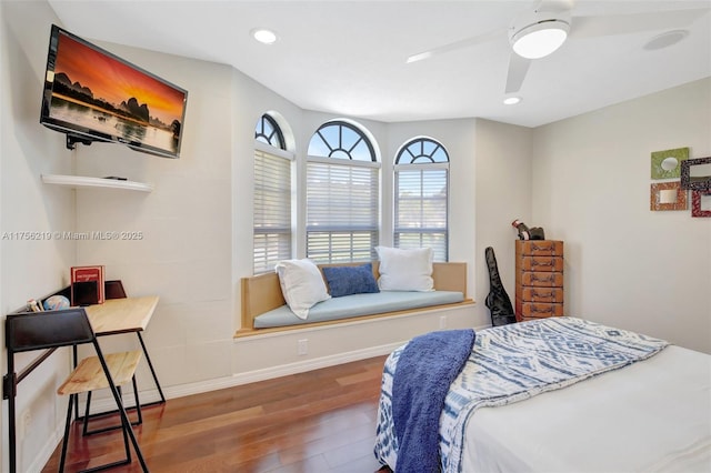 bedroom featuring wood finished floors, baseboards, recessed lighting, and ceiling fan