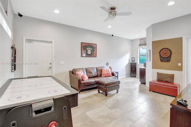 recreation room featuring a ceiling fan, recessed lighting, baseboards, and light tile patterned flooring