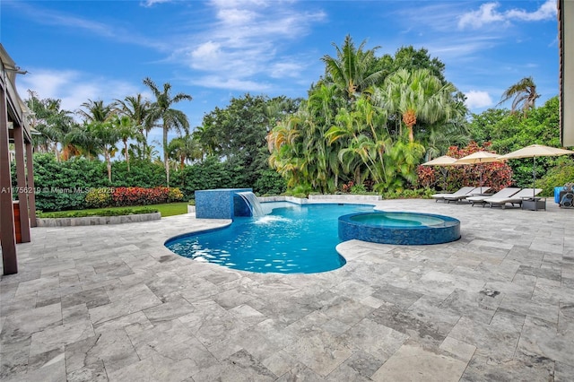 view of swimming pool featuring a patio and a pool with connected hot tub