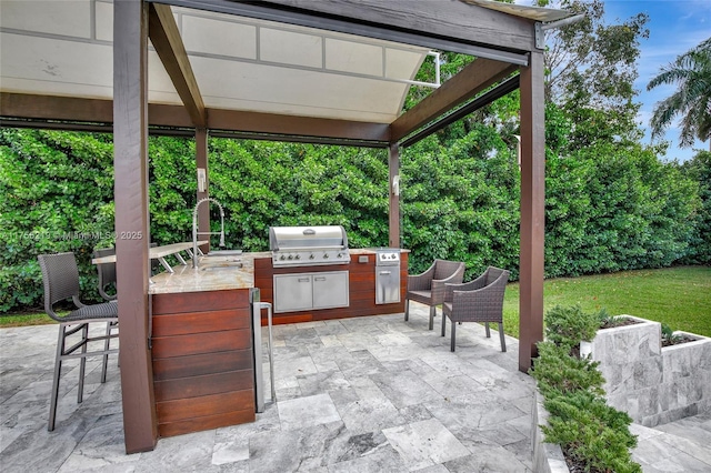 view of patio featuring a grill and exterior kitchen
