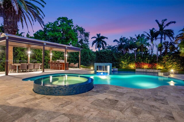 12200 SW 2nd St, Plantation, FL 33325 - view of swimming pool with a pool with connected hot tub and a patio area