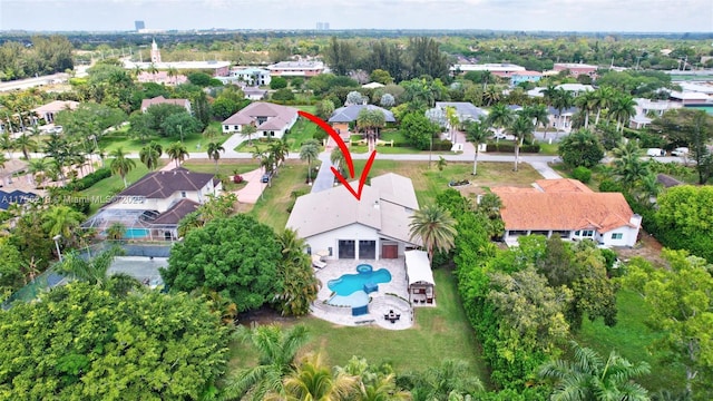 aerial view of residential area featuring a pool area
