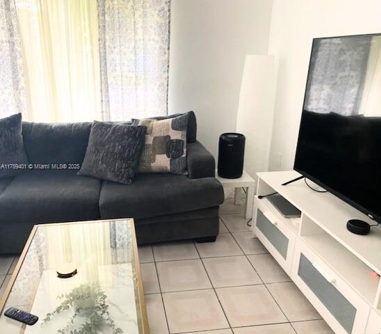 living area with light tile patterned floors