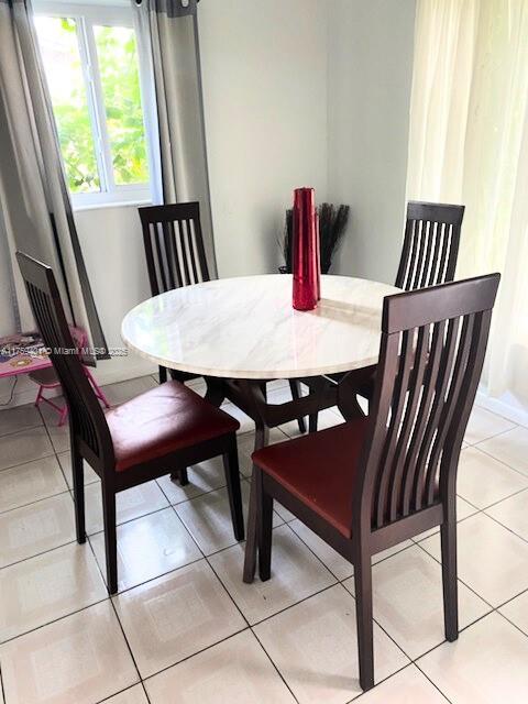 dining room with light tile patterned floors