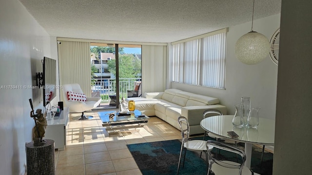 living area with a textured ceiling and tile patterned floors