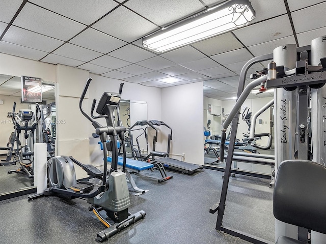 exercise room featuring a drop ceiling