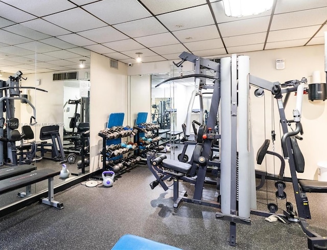 workout area featuring visible vents and a drop ceiling