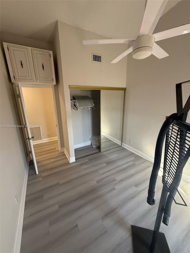 990 NE 212th Ter Unit 990-03, Miami, FL 33179 - unfurnished bedroom featuring baseboards, a closet, visible vents, and light wood-style floors