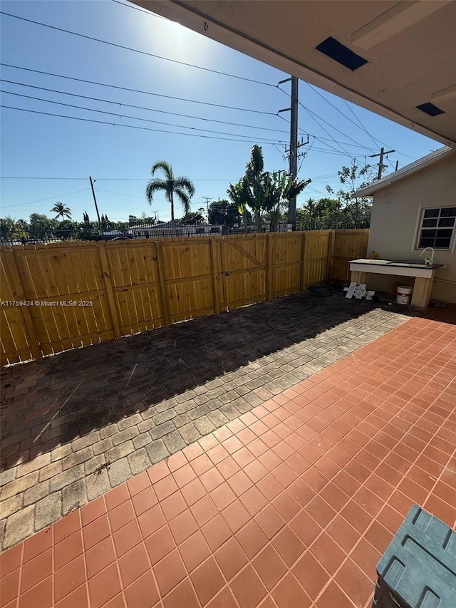 990 NE 212th Ter Unit 990-03, Miami, FL 33179 - view of patio featuring fence