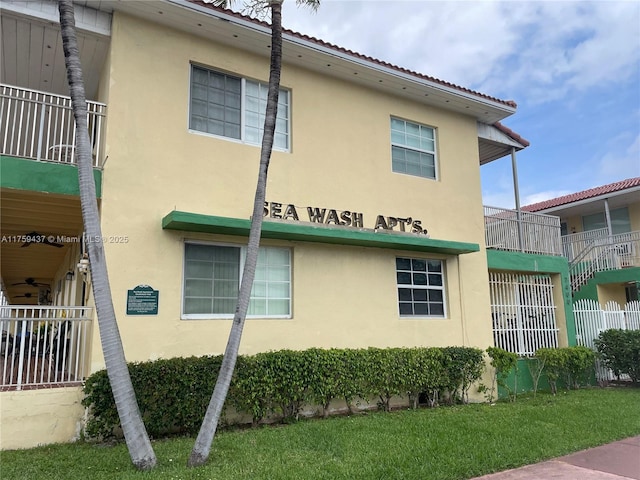 view of side of property featuring stucco siding