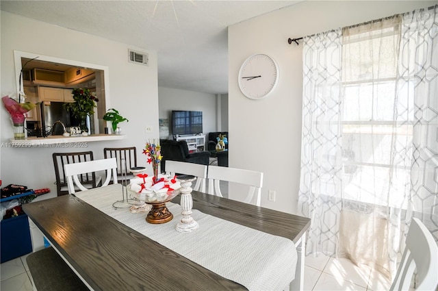 dining room featuring tile patterned flooring and visible vents