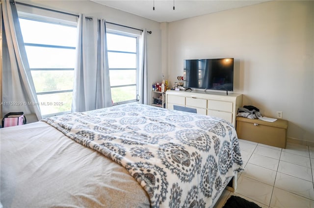 bedroom featuring light tile patterned flooring