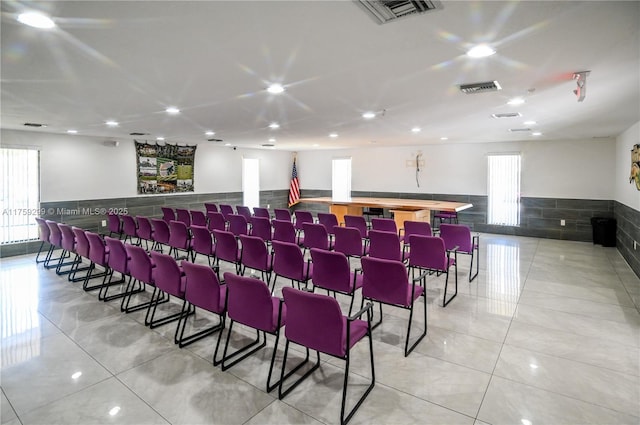 interior space with a wainscoted wall, light tile patterned flooring, visible vents, and recessed lighting