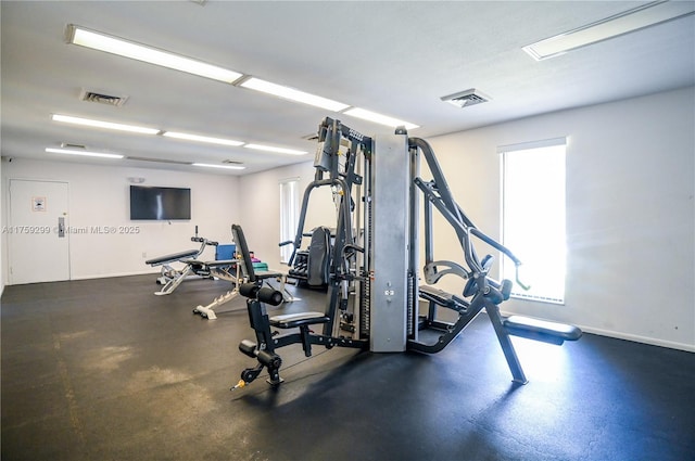 exercise room featuring baseboards and visible vents