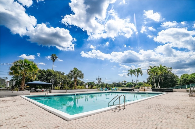 pool with a patio area