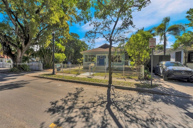 view of front of house featuring a fenced front yard and a gate