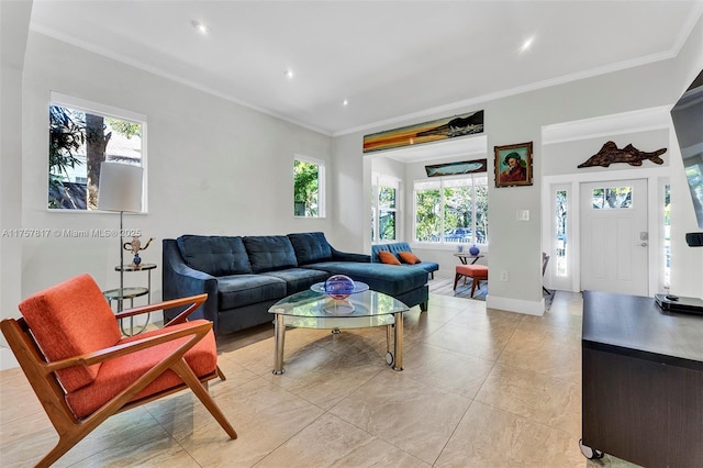 living room with recessed lighting, crown molding, and baseboards