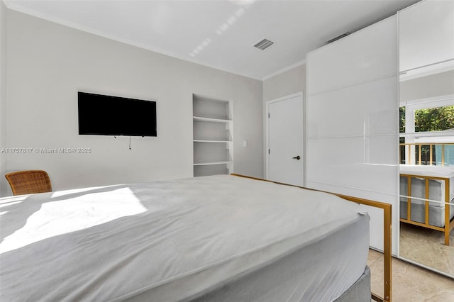 bedroom featuring ornamental molding and visible vents