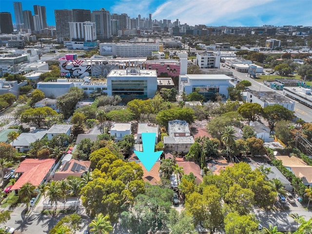 birds eye view of property with a view of city