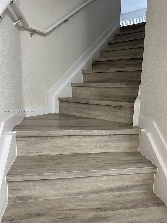 stairs with a textured wall