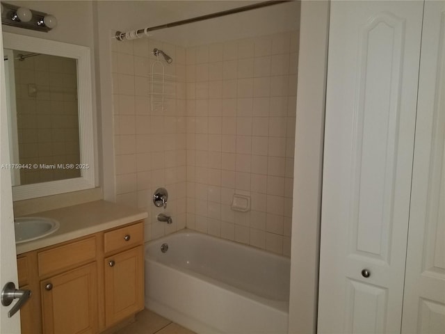 bathroom with shower / bath combination, tile patterned floors, and vanity