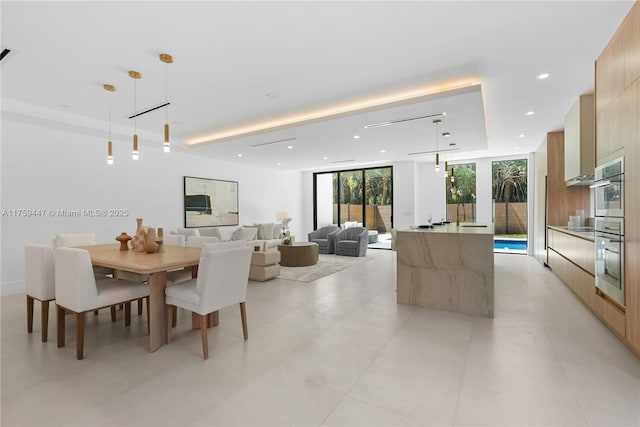 1823 NE 26th Ave, Fort Lauderdale, FL 33305 - dining space featuring recessed lighting, a wall of windows, and a raised ceiling