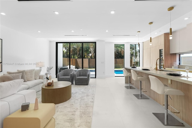 1823 NE 26th Ave, Fort Lauderdale, FL 33305 - living area featuring a healthy amount of sunlight and recessed lighting
