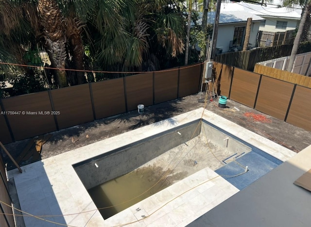 view of pool with fence