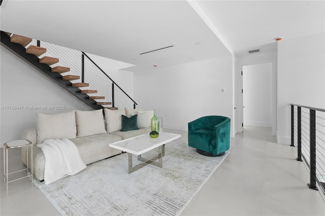 1823 NE 26th Ave, Fort Lauderdale, FL 33305 - living area with baseboards, concrete floors, visible vents, and stairs
