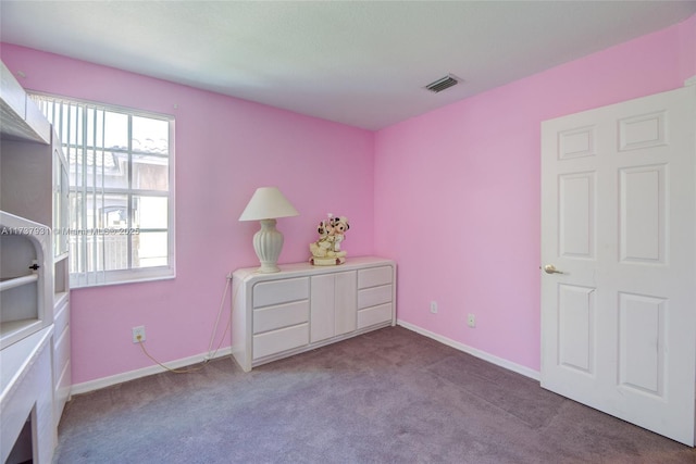 bedroom featuring baseboards, visible vents, carpet flooring, and multiple windows