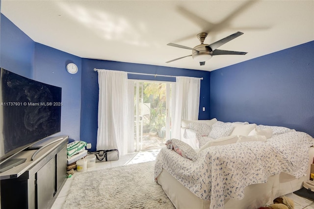 tiled bedroom featuring a ceiling fan and access to outside