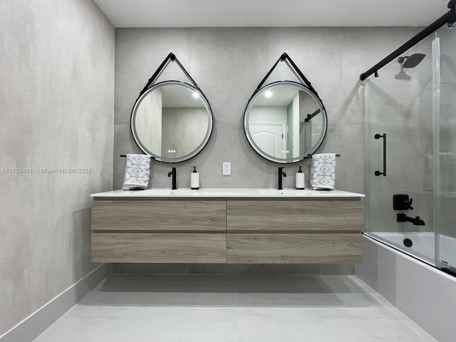 full bathroom featuring double vanity and bath / shower combo with glass door