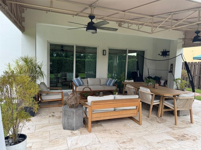 view of patio featuring ceiling fan, fence, and an outdoor hangout area