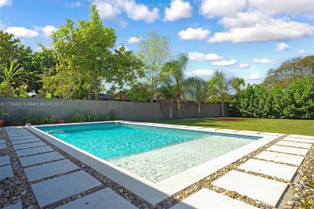 view of pool with a lawn, a patio area, a fenced backyard, and a fenced in pool