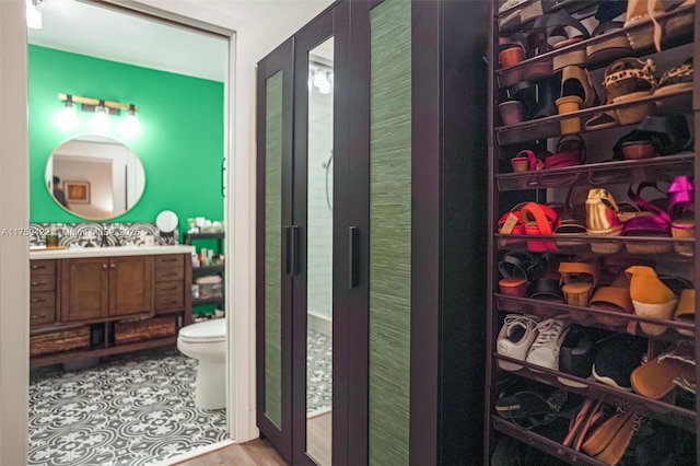 bathroom featuring toilet and vanity