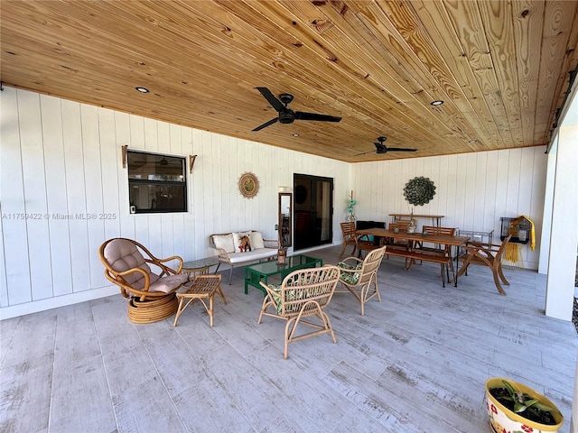 view of patio featuring outdoor dining space, outdoor lounge area, and ceiling fan