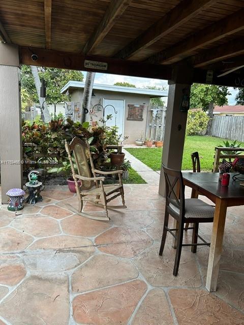 view of patio / terrace featuring fence