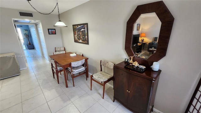 dining room with visible vents, baseboards, and light tile patterned flooring