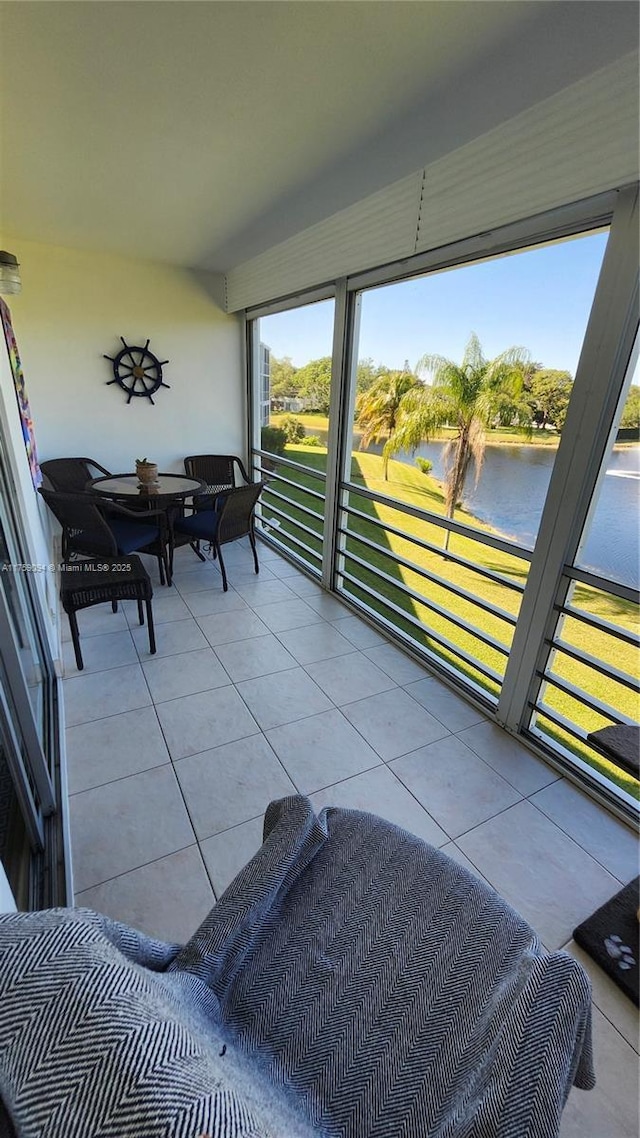 balcony featuring a water view