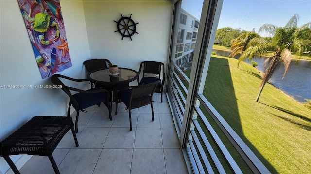 balcony featuring a water view