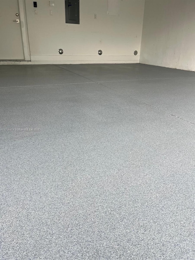 details featuring speckled floor and electric panel