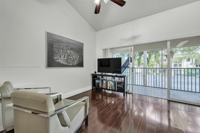 living room with high vaulted ceiling, ceiling fan, baseboards, and wood finished floors