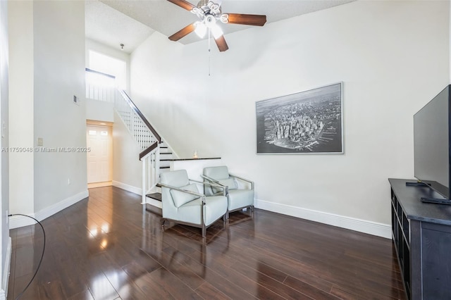 interior space featuring stairs, baseboards, and wood finished floors