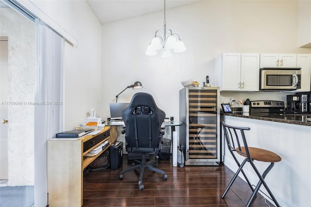 home office featuring a chandelier, beverage cooler, and dark wood-style flooring