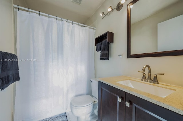 bathroom with vanity, toilet, and a shower with curtain