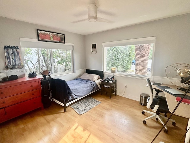 bedroom featuring light wood-style floors and ceiling fan