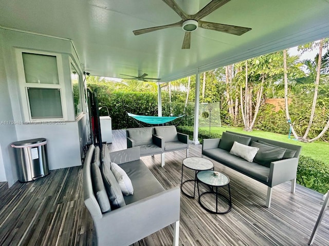 sunroom / solarium with ceiling fan