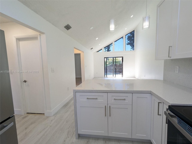 kitchen with range with electric stovetop, visible vents, high vaulted ceiling, light wood-type flooring, and a peninsula