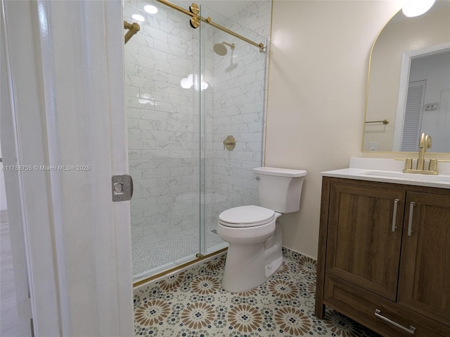 full bath featuring a stall shower, vanity, and toilet