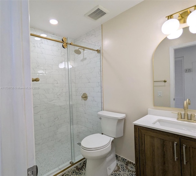 bathroom featuring a stall shower, visible vents, vanity, and toilet